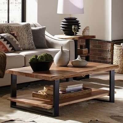 Rustic wood coffee table styled with woven baskets and ceramic vases