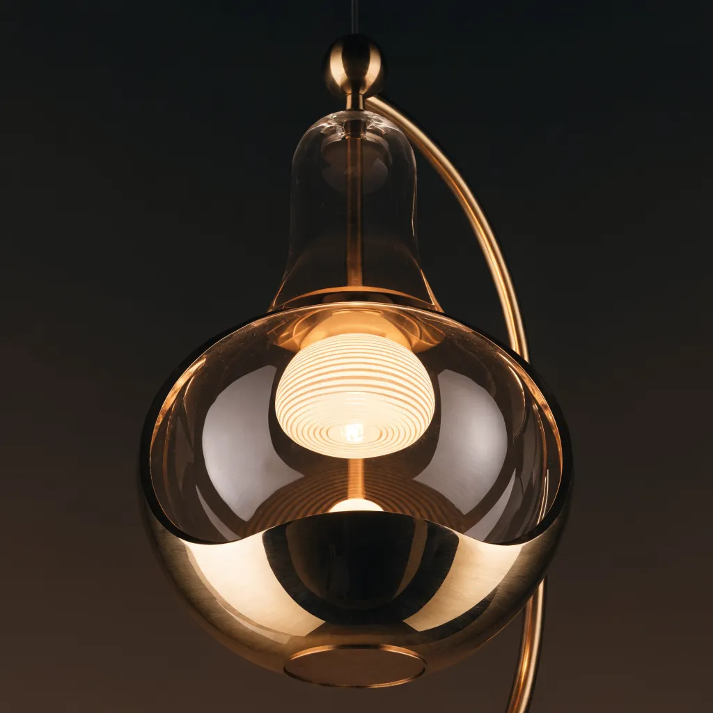 Modern brass and glass globe pendant light fixture
